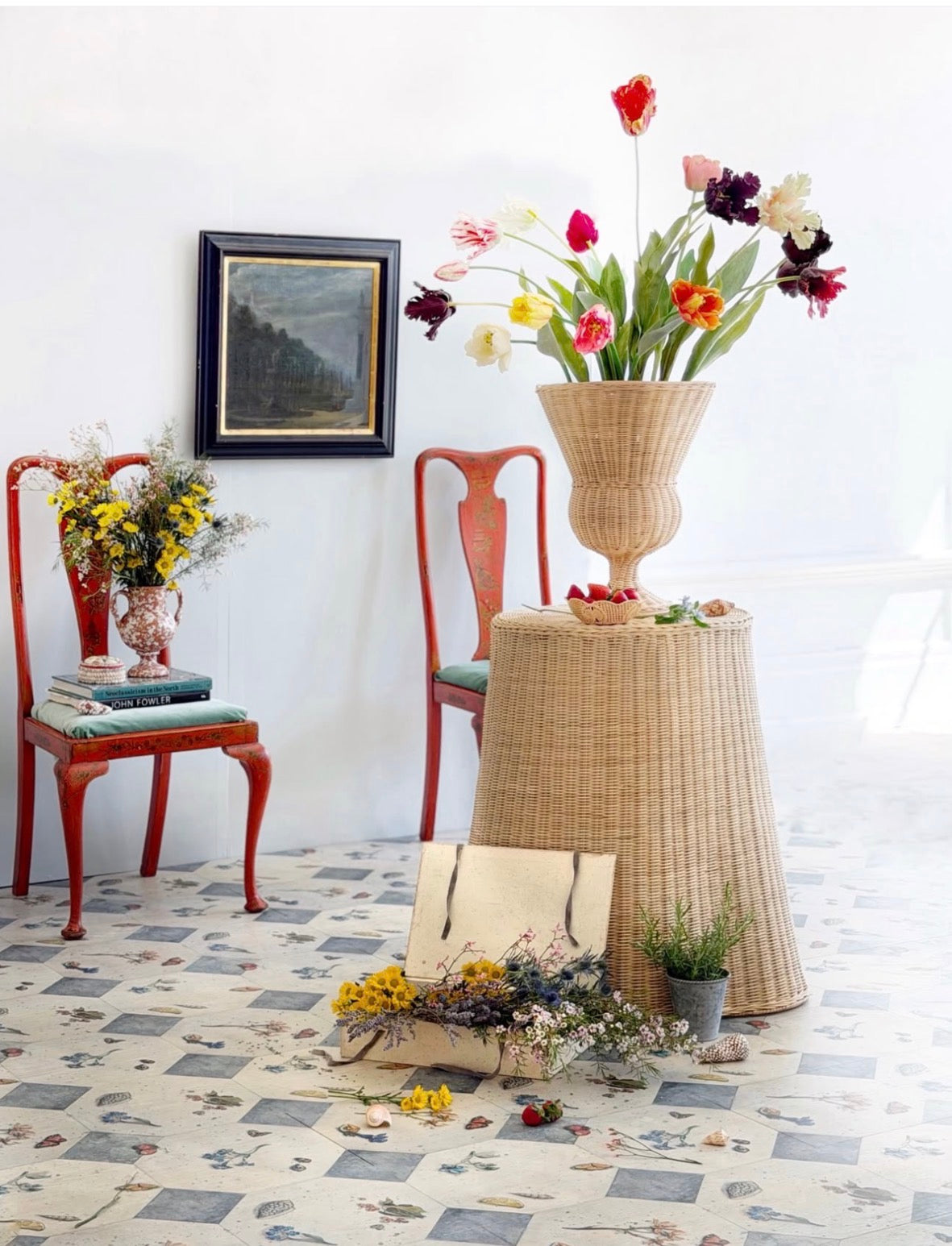 Decorative room with floral arrangements, chairs, and a lamp on a white background